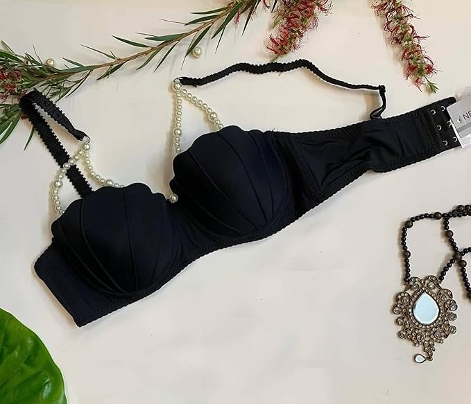 Black balconette push-up bra with pearl chain straps worn by a model, front and back view.