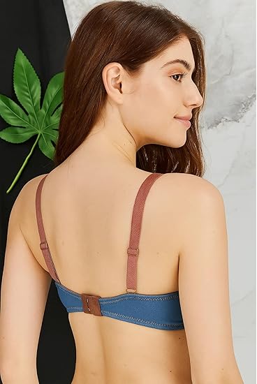 Woman wearing a dark blue-grey push-up bra with subtle sheen and structured cups.