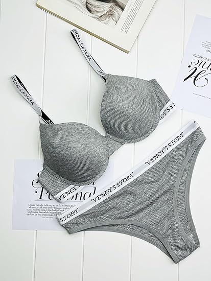 Woman wearing a light grey bra and panty set with white elastic branded bands reading "Vency's Story".